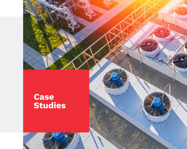 Website banner image showing rooftop HVAC units with large circular fans and metal grating.